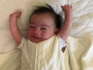Cute_baby_throws_his_hands_up.png