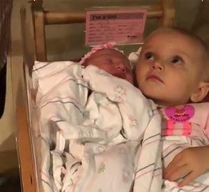 little_girl_guards_newborn.jpg